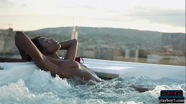 Ebony beauty from Cameroon Mimi Desuka gets naked in a pool for Playboy